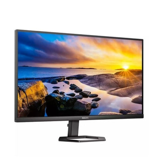 Philips 27-inch 4K UHD IPS monitor on stand displaying a vivid sunset landscape.