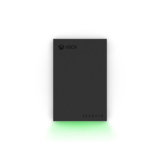 Front view of the Seagate Xbox Game Drive 2TB (STKX2000400) — slim black external hard drive featuring Xbox and Seagate logos, illuminated by a vibrant green LED glow along the base, designed for Xbox Series X|S and Xbox One consoles.