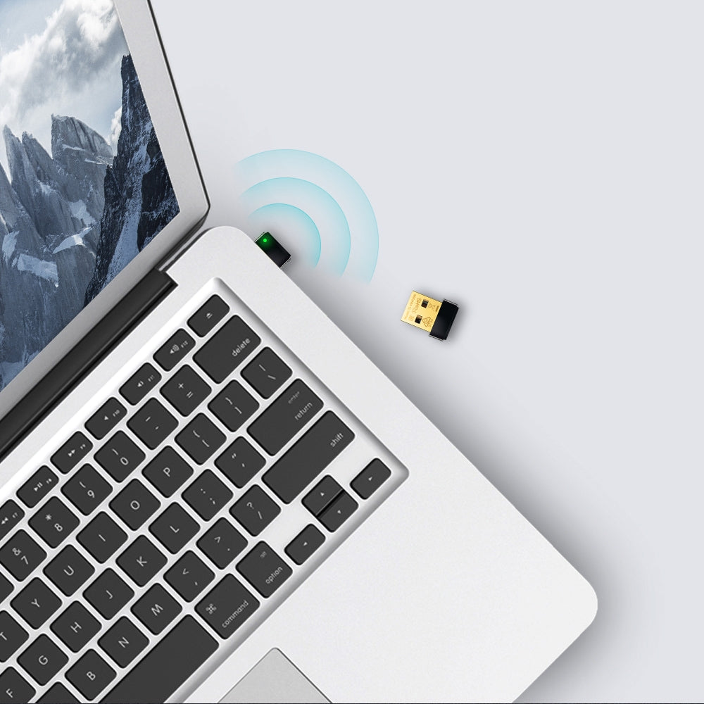 TP-Link TL-WN725N Nano USB Wi-Fi Adapter plugged into a laptop, illustrating wireless connectivity and compact design ideal for portability.