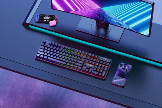 Mikuso XK-601 Spectra Gaming setup with keyboard, monitor, and smartphone on a desk