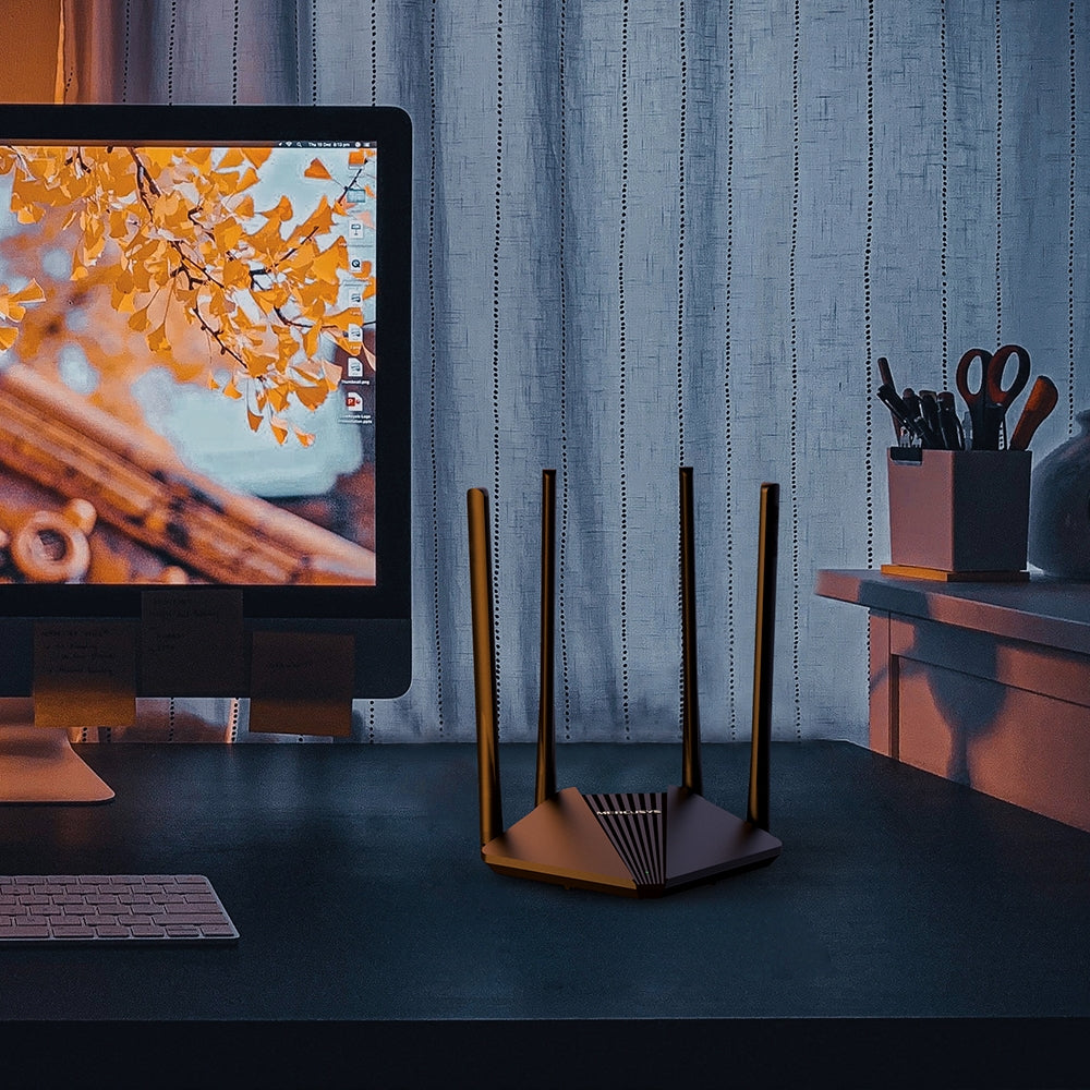 Mercusys MR30G on a Home Office Desk Beside Computer Monitor and Accessories, Black