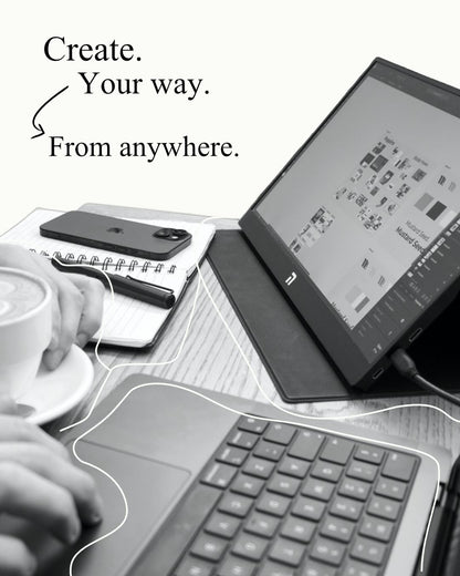 Novus 15.6 inch FHD IPS Portable Monitor being used as a second screen with a laptop in a cafe setting for remote work productivity.