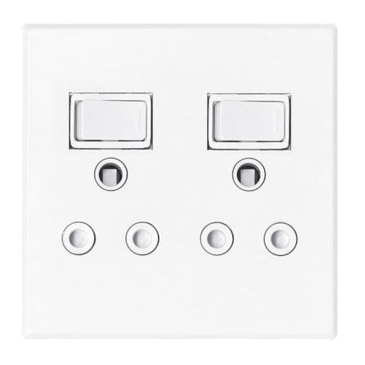White wall switch panel with two rectangular switches and four circular sockets on a white background