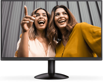 Monitor displaying two women laughing, with AOC branding visible.