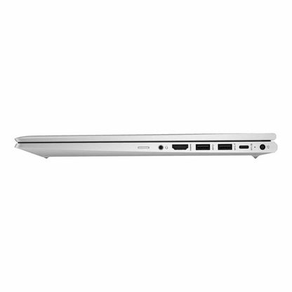 Side view of a silver laptop on a white background