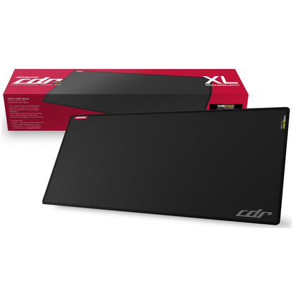 Black gaming mouse pad with 'CDR' branding next to its packaging on a white background