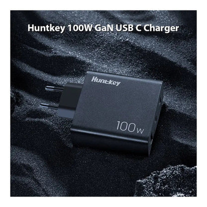 Image showing the charger powering a laptop, phone, and tablet simultaneously.

