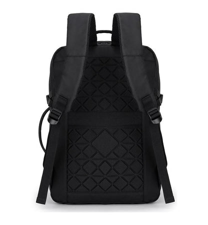 Back view of black adjustable laptop backpack showing padded shoulder straps and diamond-patterned breathable back panel for ergonomic comfort.