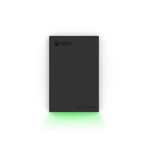 Front view of the Seagate Xbox Game Drive 2TB (STKX2000400) — slim black external hard drive featuring Xbox and Seagate logos, illuminated by a vibrant green LED glow along the base, designed for Xbox Series X|S and Xbox One consoles.