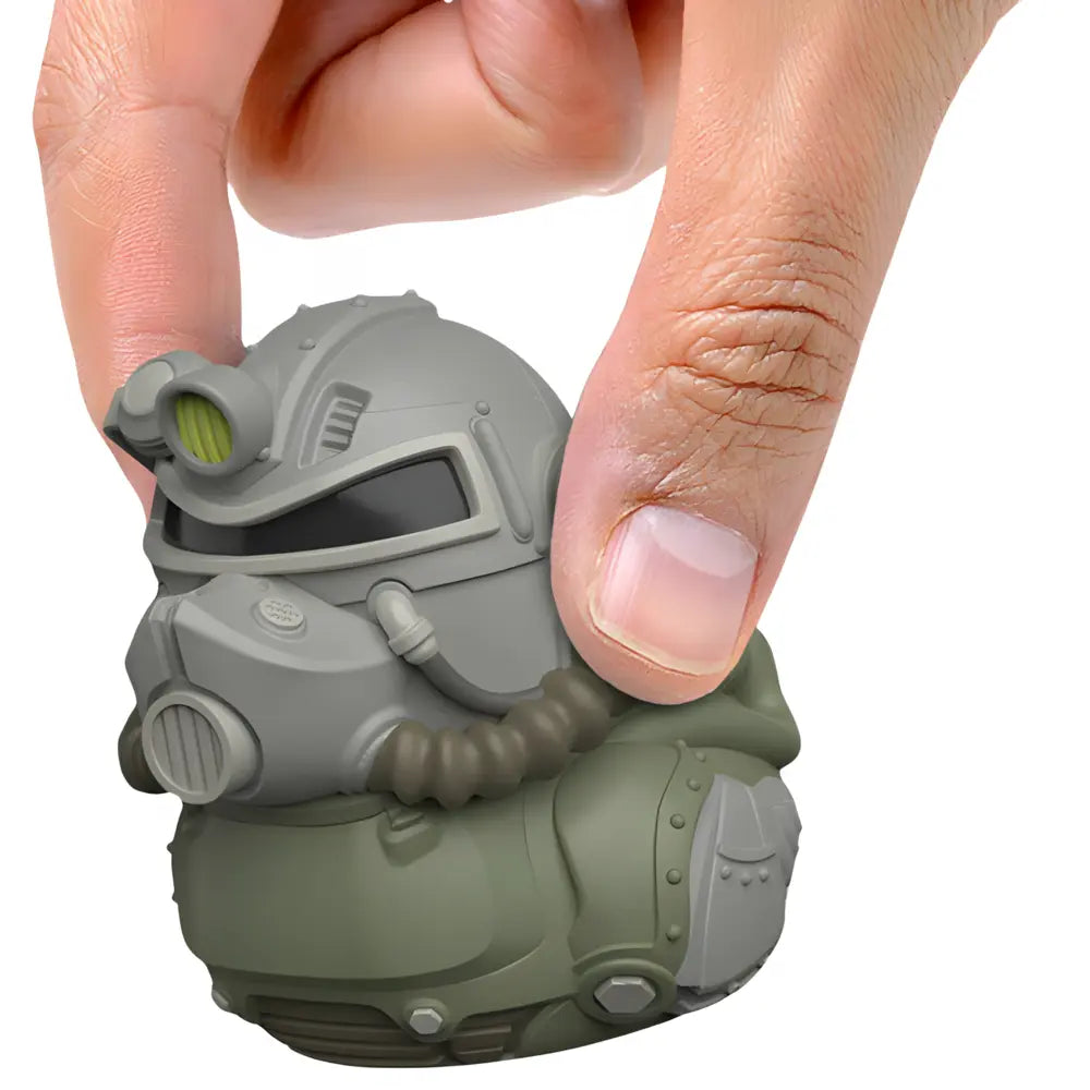 Tubbz Mini Fallout T-51 Armor in the shape of a duck with a hand holding it, on a white background