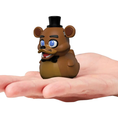 Tubbz Mini FNAF Freddy Vinyl Figurine in a hand against a white background