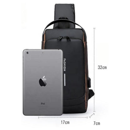 Black crossbody bag with measurements and an iPad for scale on a white background