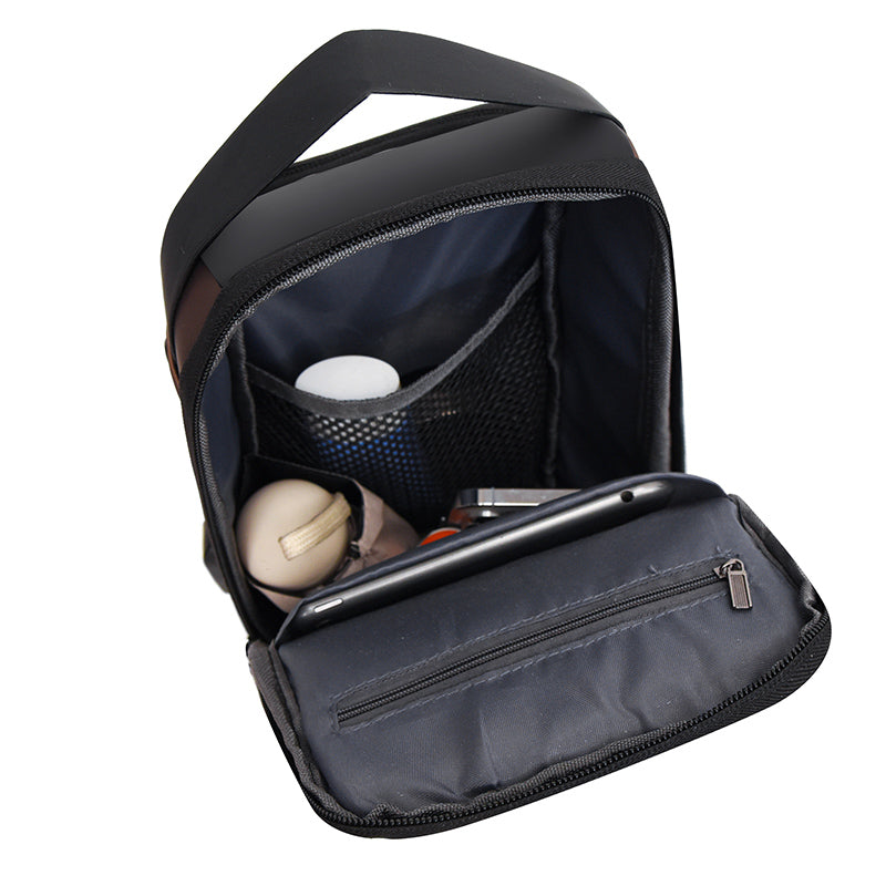 Interior view of the X23 Cross Body Bag showing various items