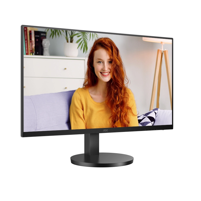 Slight angled view of the AOC u27b3cf 27 inch 4k uhd ips monitor displaying a person in a home environment