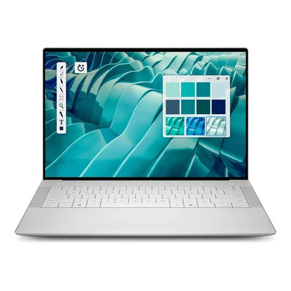 A silver Dell Premium 14 14.5" laptop shown open against a plain white background, with a colorful abstract wallpaper on the screen and a built-in keyboard.