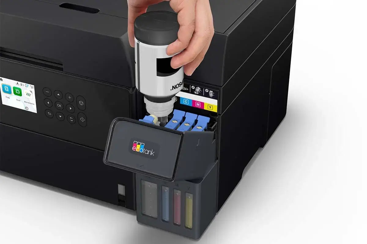 Person inserting an ink cartridge into a printer with a visible ColorBok brand on the cartridge.