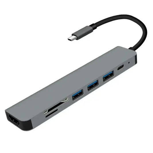 Gray M-Link 7-in-1 USB-C hub with multiple ports on a white background