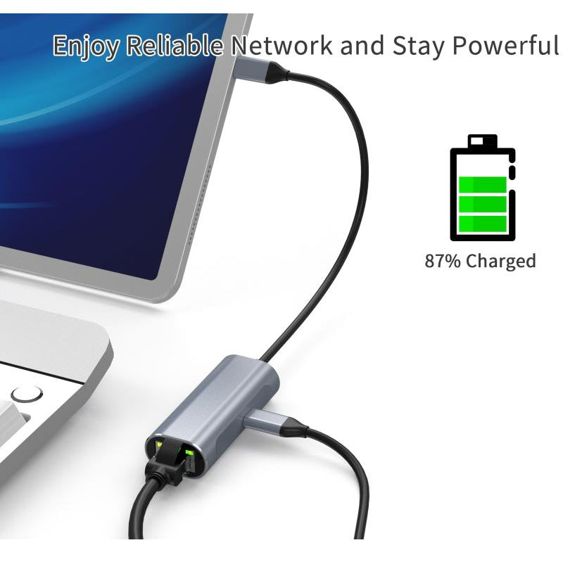 Computer with USB-C hub and cable, displaying 87% battery charge.