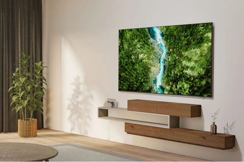 Modern living room with a Samsung 50" U8000F Crystal UHD 4K Smart TV displaying a nature scene, wooden entertainment console, and decorative plants.