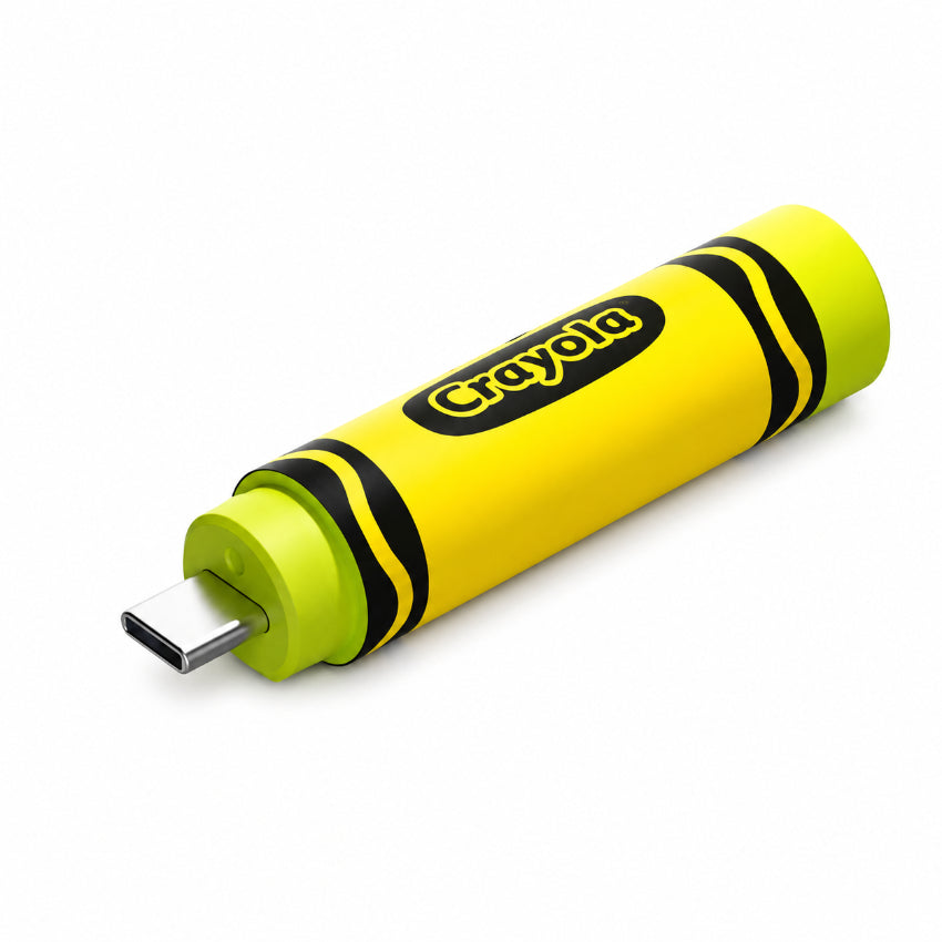 A yellow and lime green Crayola-branded USB-C flash drive designed to look like a crayon, shown on a clean white background.