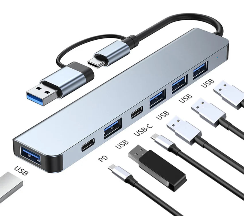 Multi-port USB hub with various cables on a white background