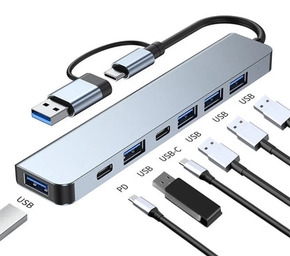 Multi-port USB hub with various cables on a white background